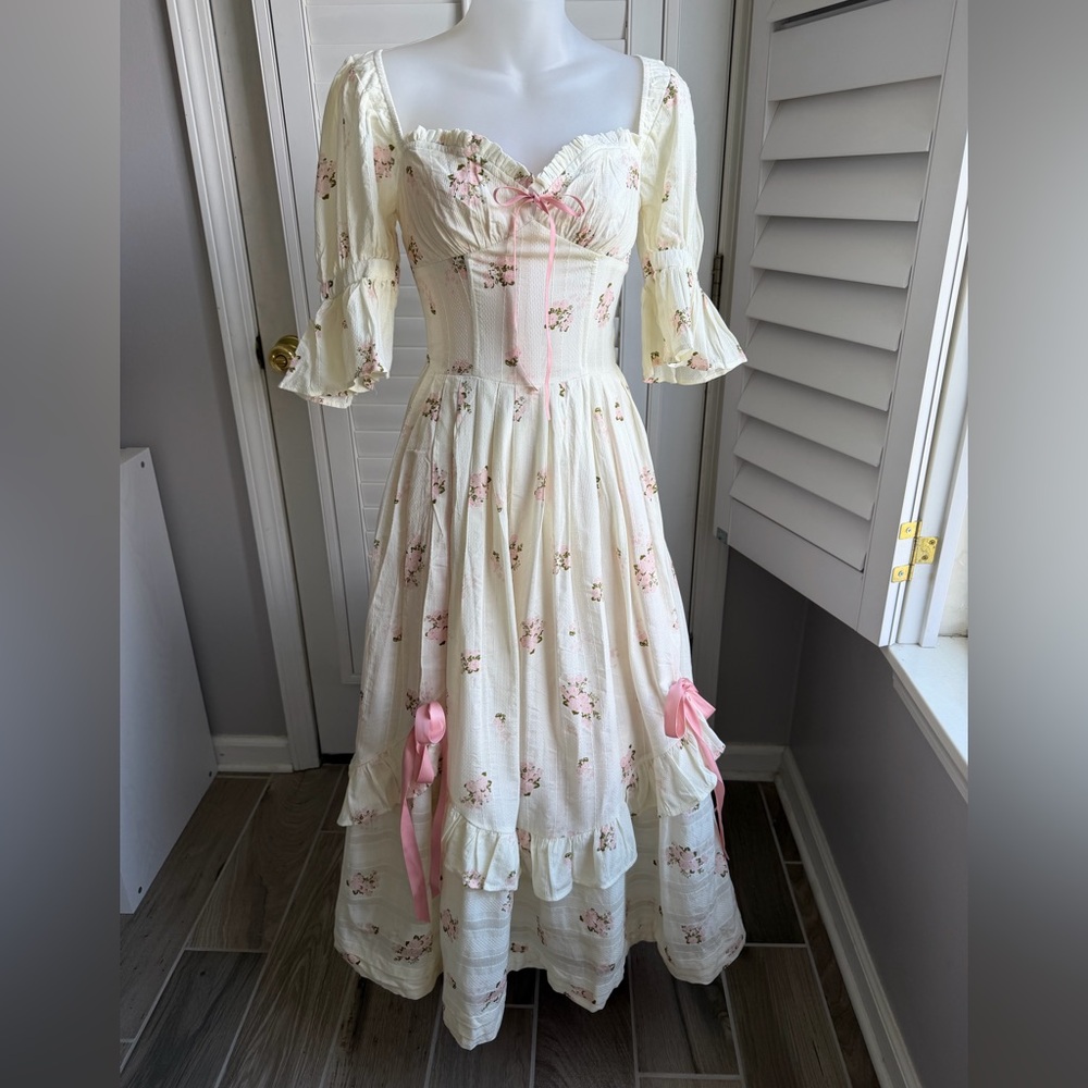 Lumina Venus Ivory Floral Prairie Dress with Pink Ribbon Details